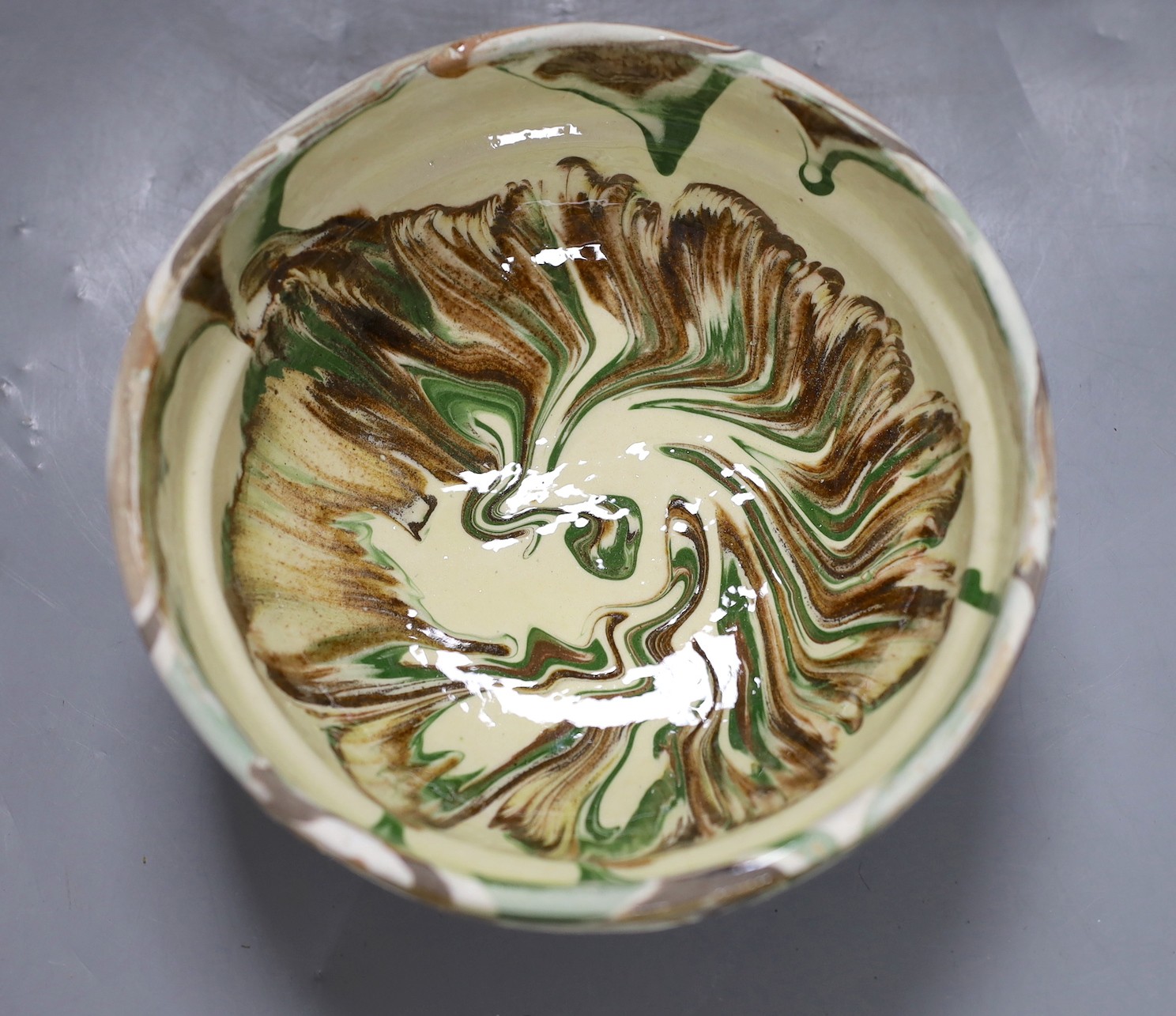 Six French slipware bowls, 16.5cm diameter